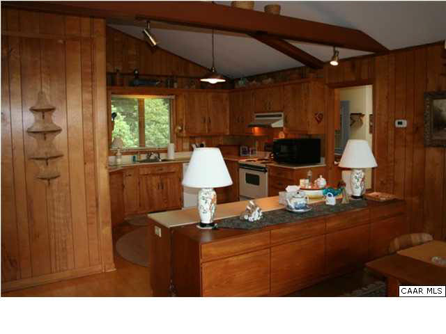 2235 Poor House Road Syria, VA 22743 - Photo 16 of 24 a open kitchen view with dining table and chairs