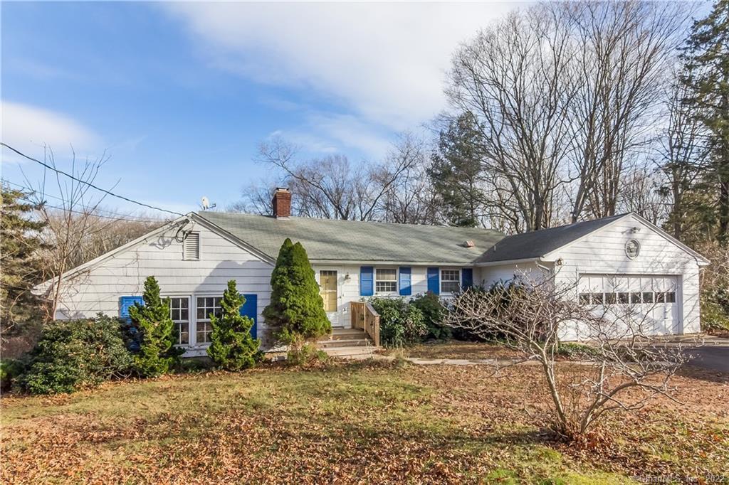 34 Warpas Road Madison, CT 06443 - Photo 1 of 1 a front view of a house with garden