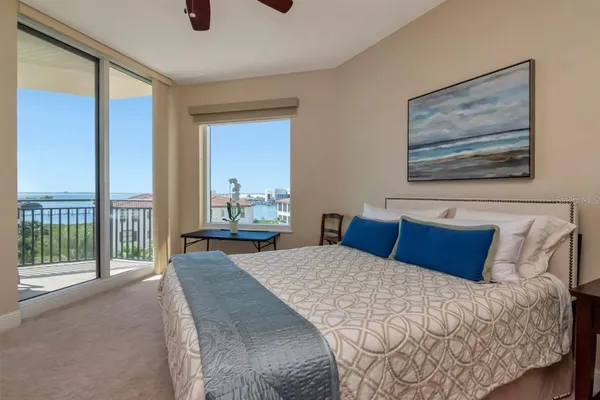 a bedroom with a bed and a closet