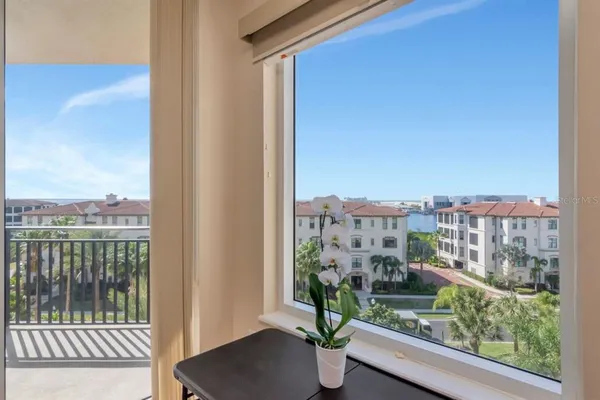 a living room with furniture flowerpot and a potted plant