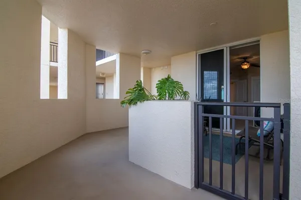 a lobby with furniture and potted plant
