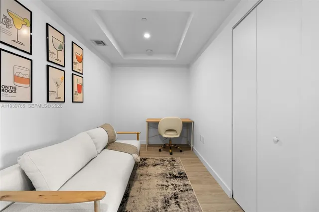 a living room with furniture and a rug