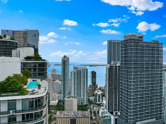 a view of a balcony with a couple and buildings