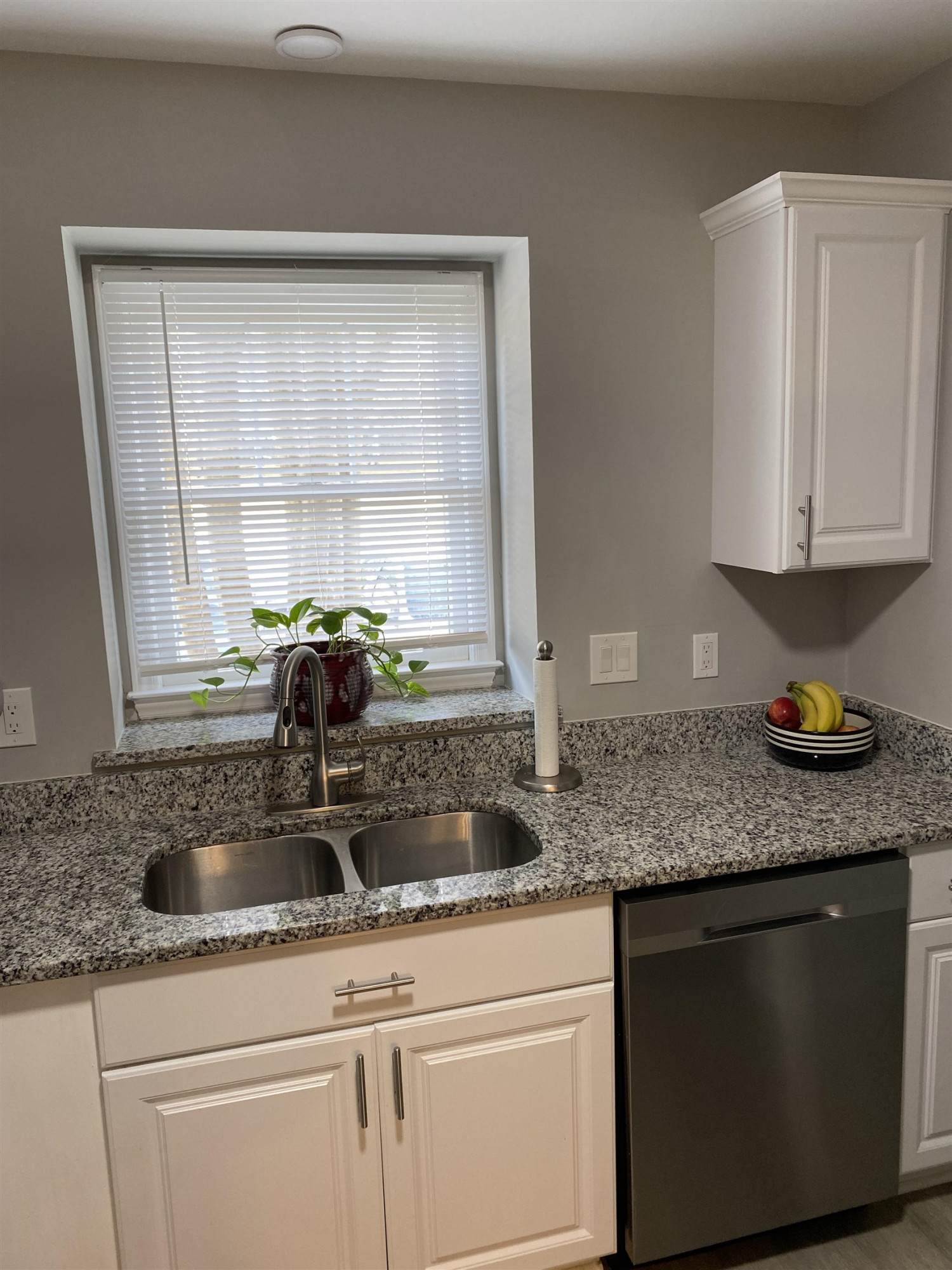 643 Springview Trail Garner, NC 27529 - Photo 12 of 34 a kitchen with granite countertop a sink a stove and cabinets