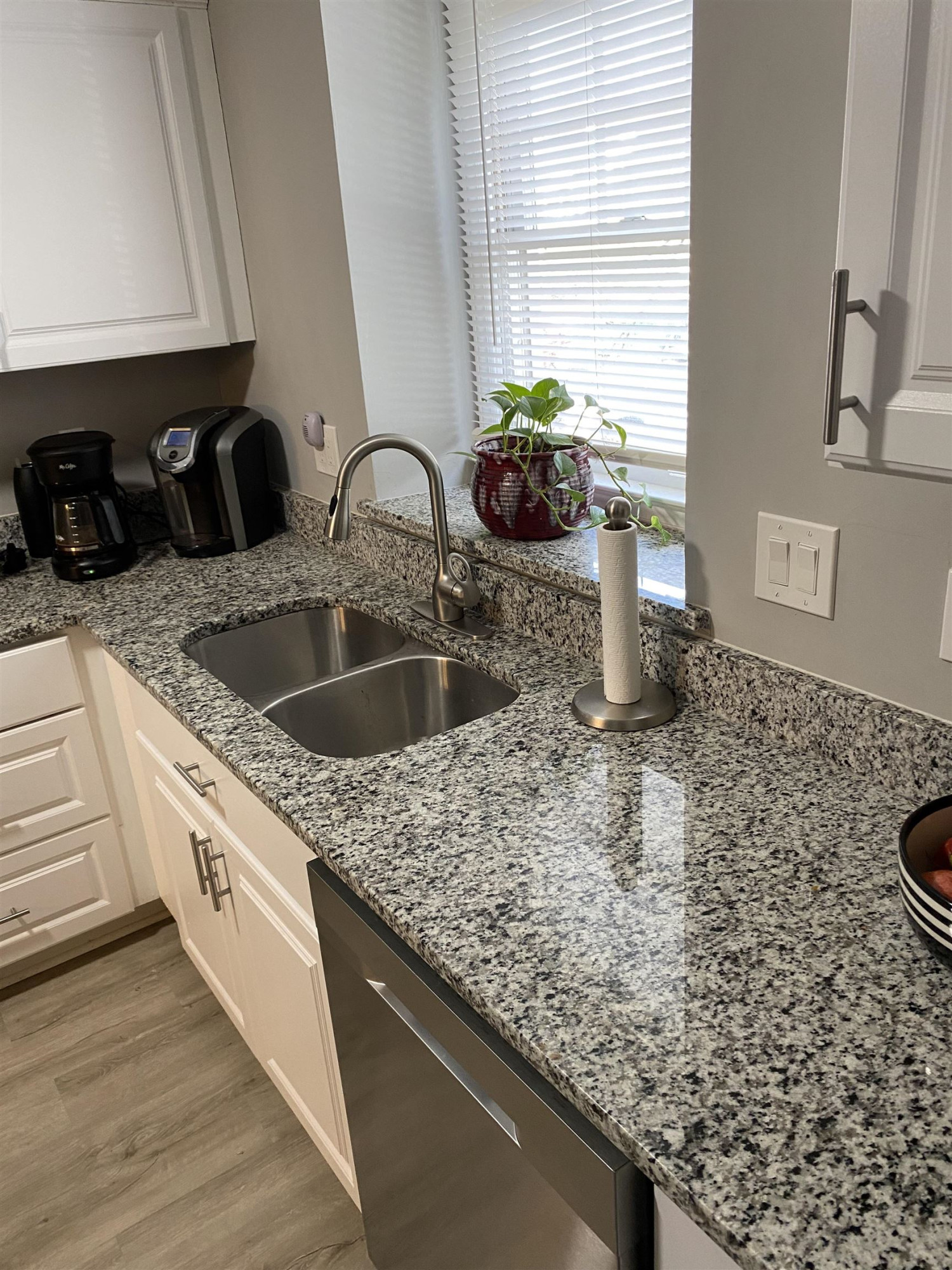 643 Springview Trail Garner, NC 27529 - Photo 16 of 34 a kitchen with granite countertop a sink a stove and cabinets
