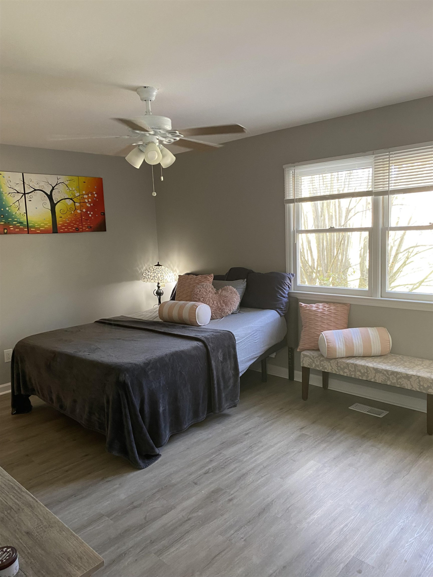 643 Springview Trail Garner, NC 27529 - Photo 22 of 34 a bedroom with a bed couch and a window