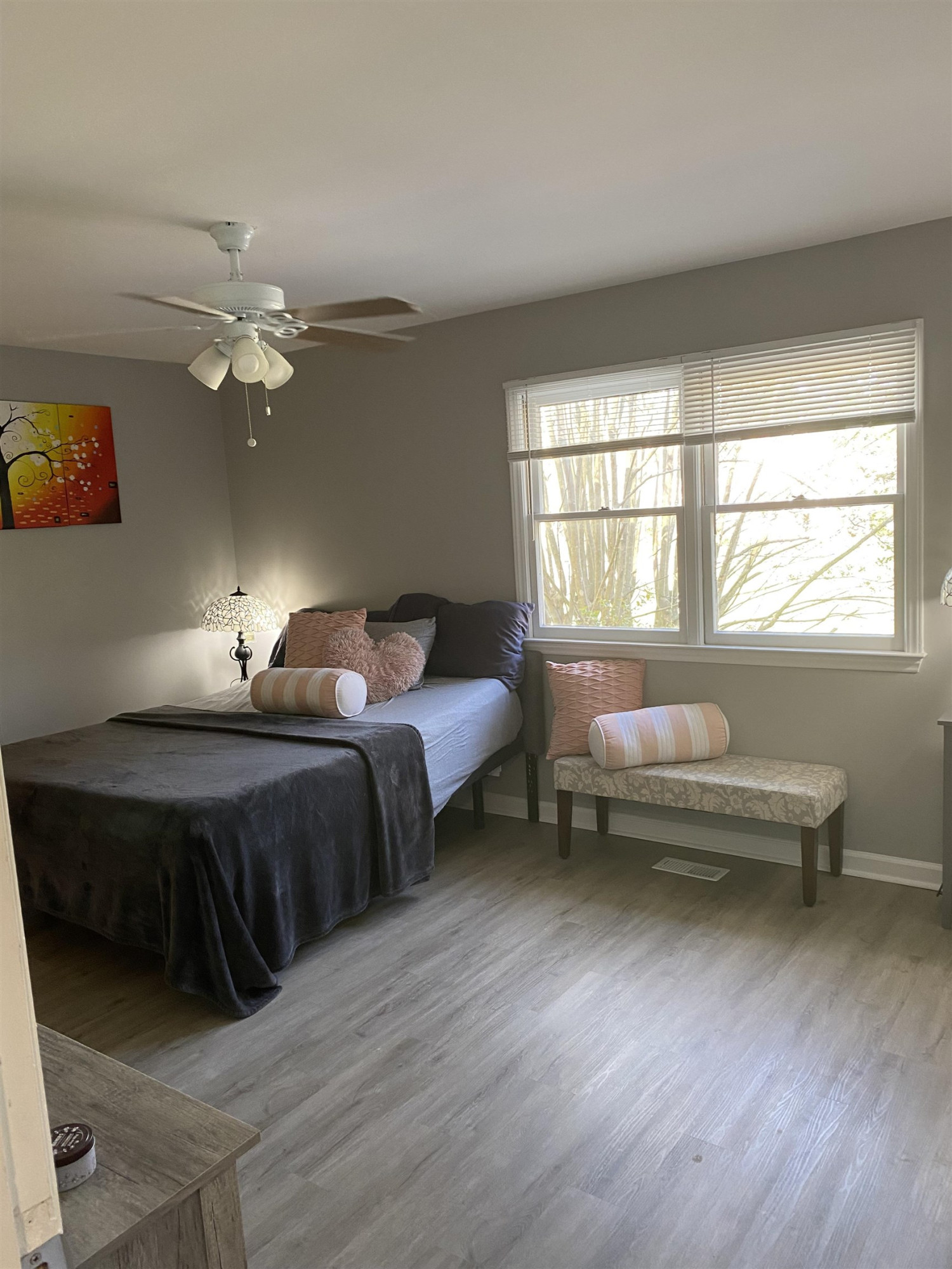 643 Springview Trail Garner, NC 27529 - Photo 24 of 34 a spacious bedroom with a bed and a chandelier