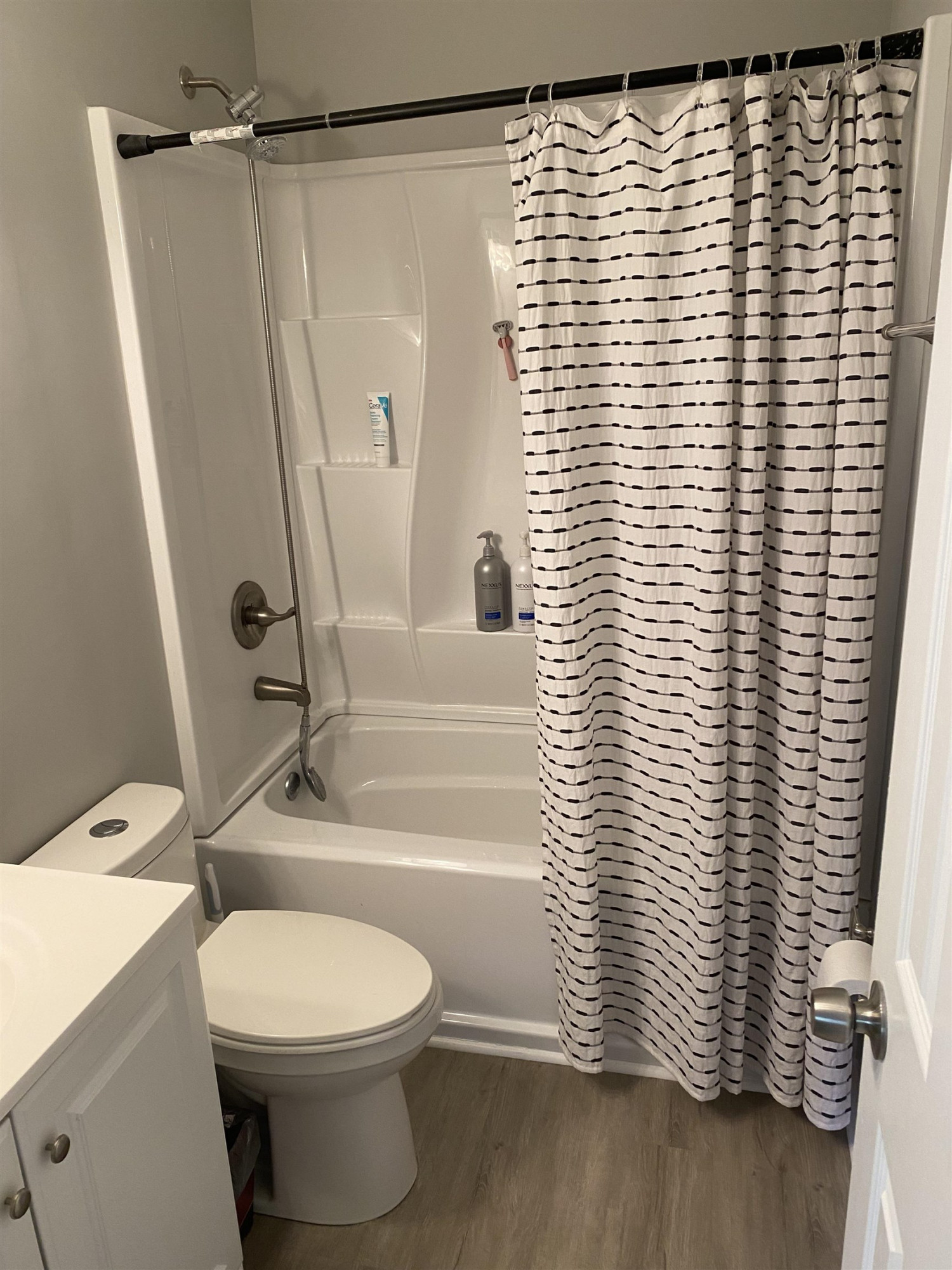 643 Springview Trail Garner, NC 27529 - Photo 25 of 34 a bathroom with a toilet and a shower curtain