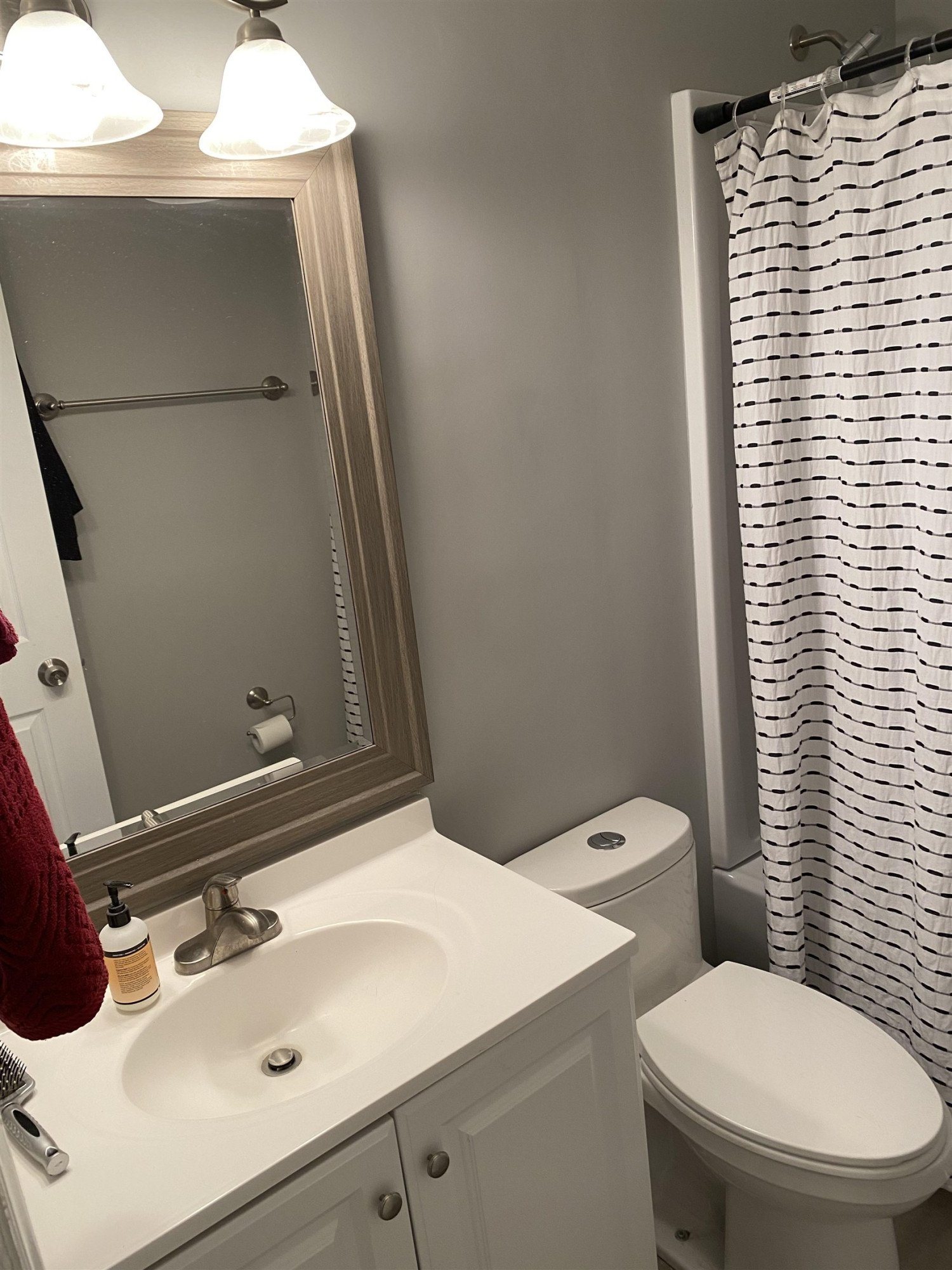 643 Springview Trail Garner, NC 27529 - Photo 29 of 34 a bathroom with a sink a toilet and mirror