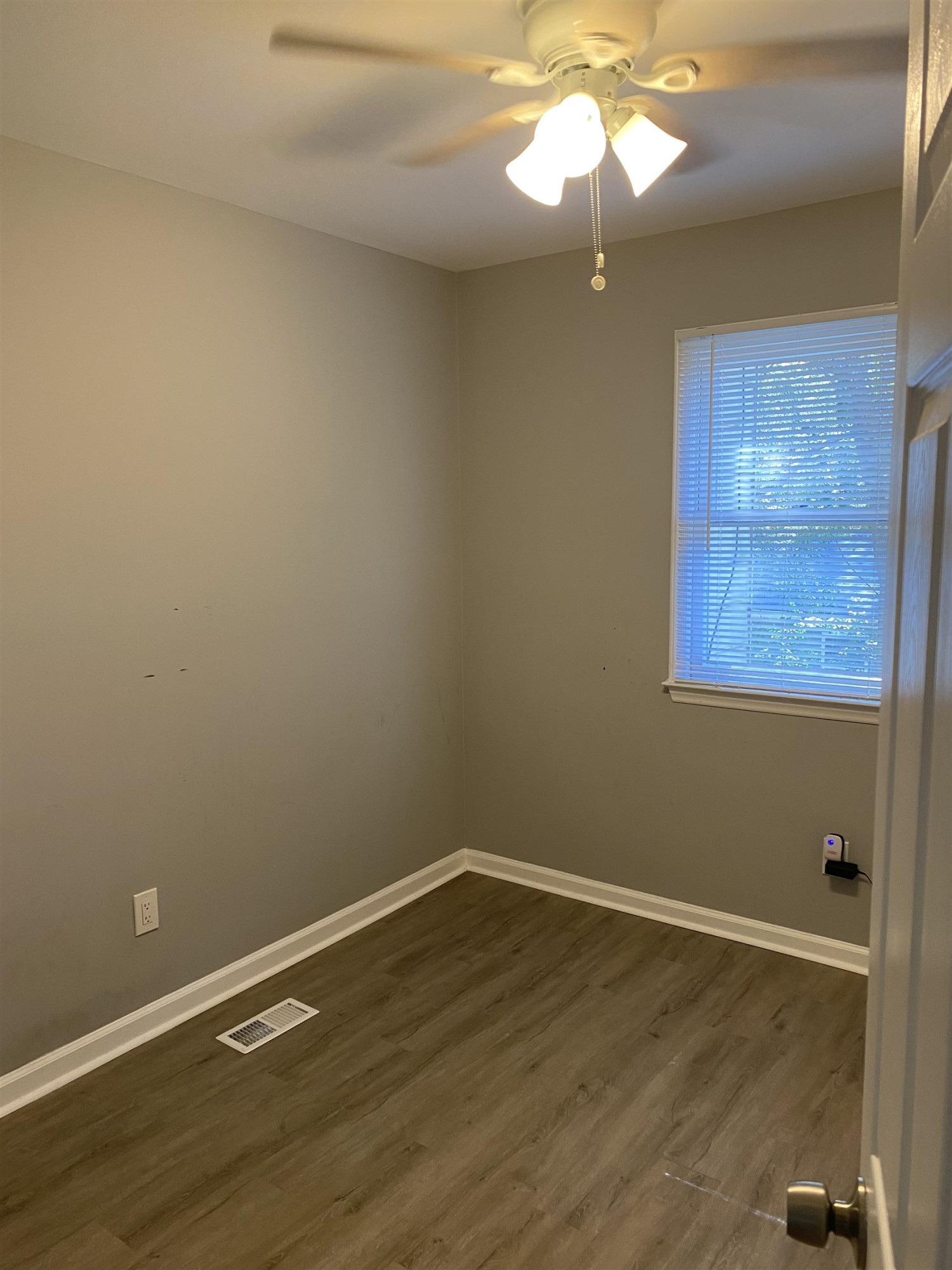 643 Springview Trail Garner, NC 27529 - Photo 32 of 34 a view of a room with wooden floor and fan