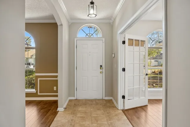 a view of an entryway with wooden floor