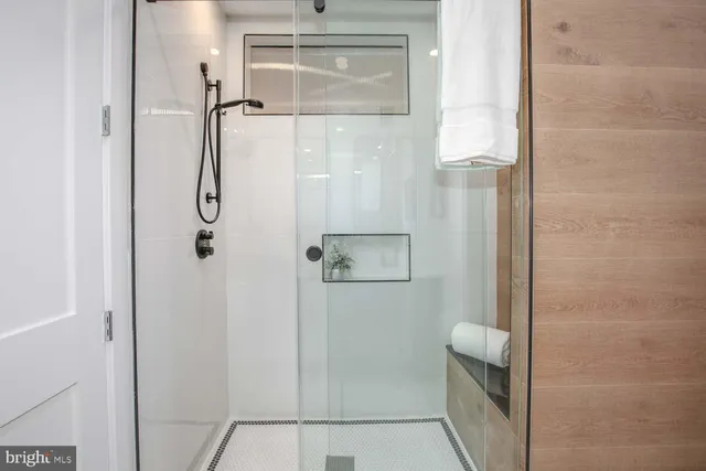 a bathroom with a double vanity sink mirror and