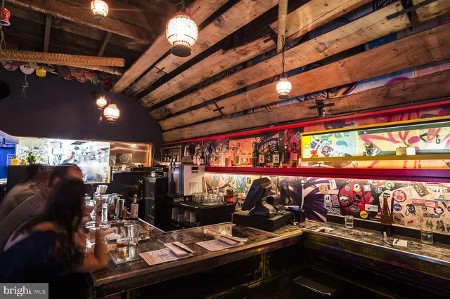 a view of a street with stores