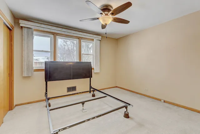 a living room with gym equipment and a large window