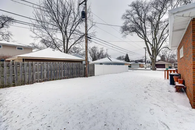 a view of house with snow on the road