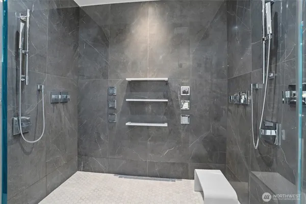 a white bath tub sitting in a bathroom next to a window