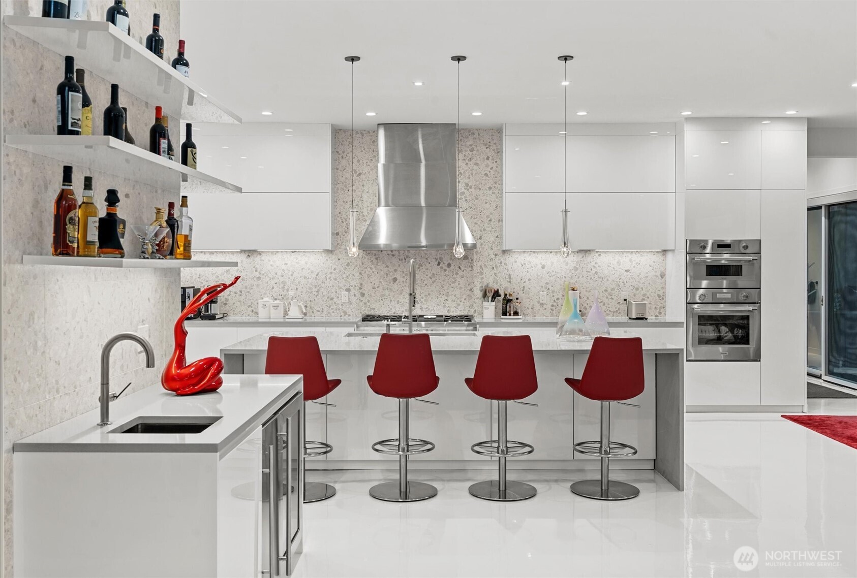 903 North 33rd Place Renton, WA 98056 - Photo 6 of 20 a kitchen with granite countertop kitchen island stainless steel appliances and chairs