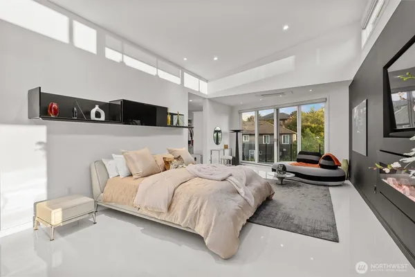 a large white kitchen with a large window
