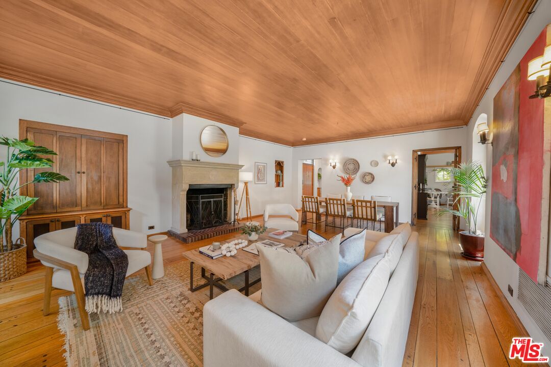 4124 Dundee Drive Los Angeles, CA 90027 - Photo 12 of 54 a living room with furniture and a fireplace