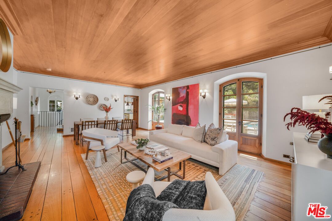 4124 Dundee Drive Los Angeles, CA 90027 - Photo 13 of 54 a living room with furniture and wooden floor