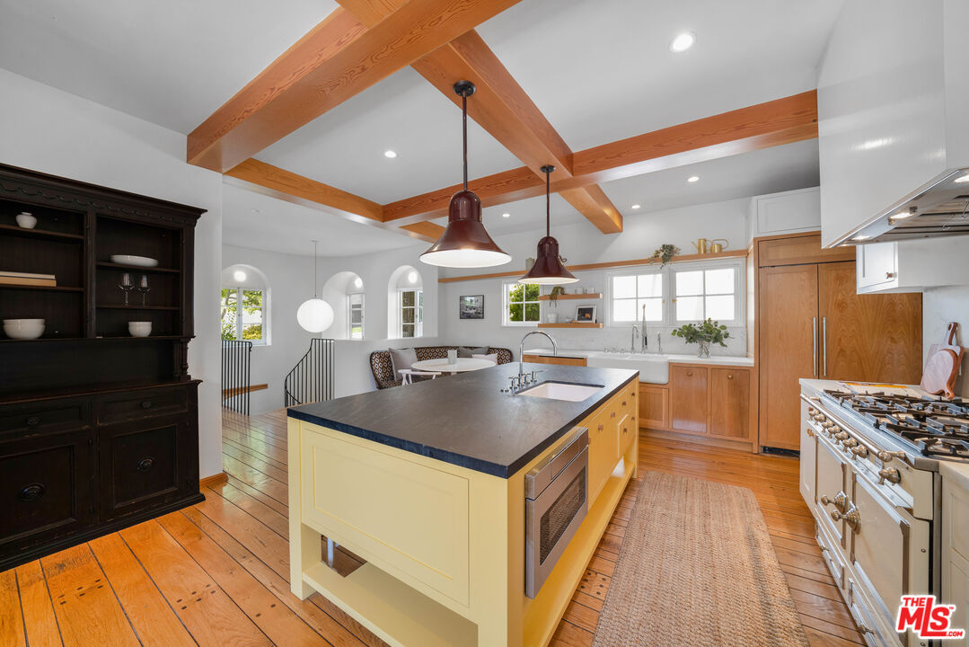 4124 Dundee Drive Los Angeles, CA 90027 - Photo 17 of 54 a kitchen with stainless steel appliances granite countertop a sink and a stove