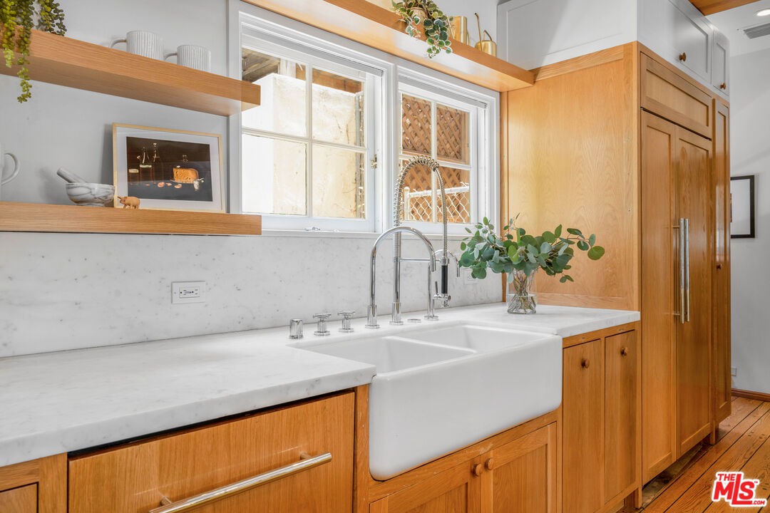 4124 Dundee Drive Los Angeles, CA 90027 - Photo 19 of 54 a bathroom with a sink and a mirror