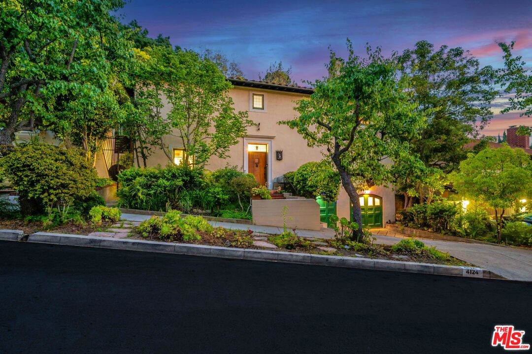 4124 Dundee Drive Los Angeles, CA 90027 - Photo 2 of 54 a view of a house with a street and a yard