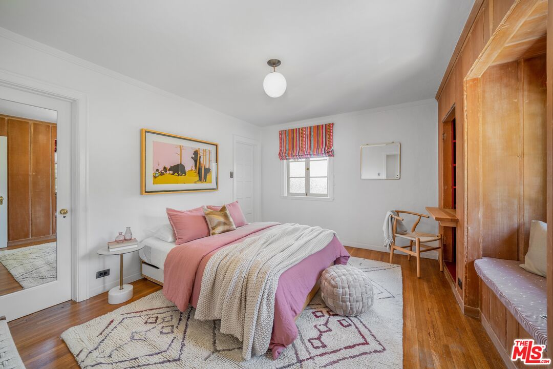 4124 Dundee Drive Los Angeles, CA 90027 - Photo 23 of 54 a bedroom with a bed and wooden floor
