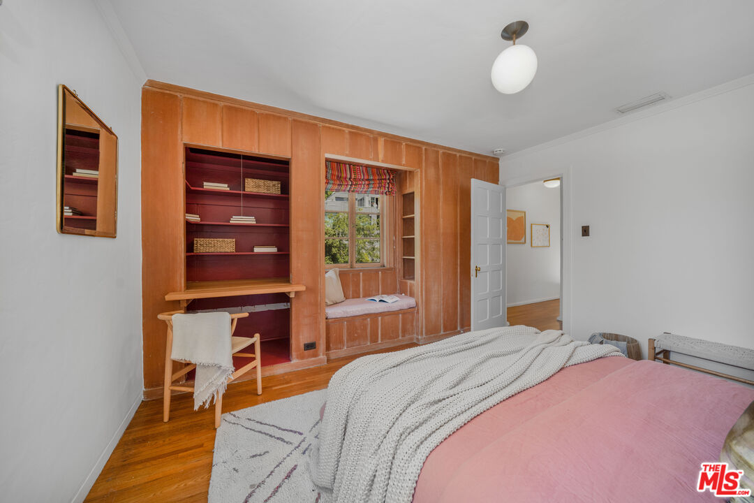 4124 Dundee Drive Los Angeles, CA 90027 - Photo 24 of 54 a bedroom with a bed and wooden floor