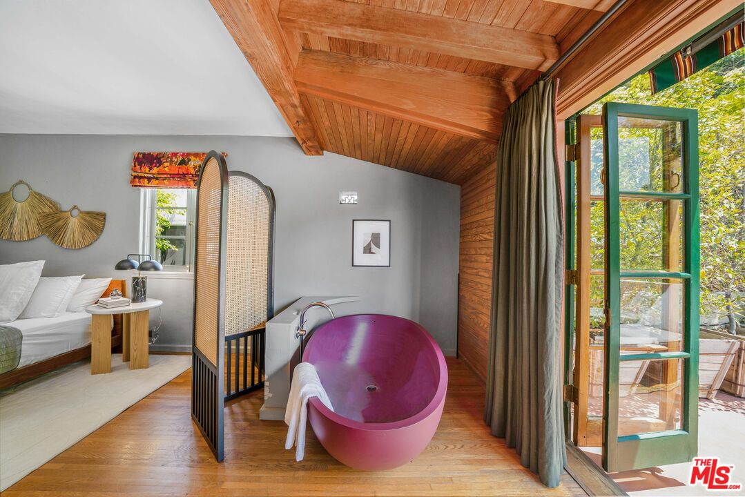4124 Dundee Drive Los Angeles, CA 90027 - Photo 30 of 54 a living room with furniture and a floor to ceiling window