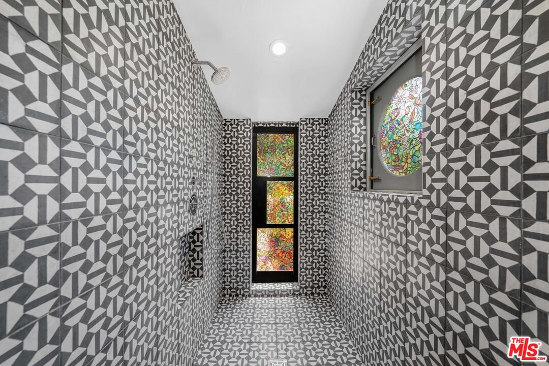 4124 Dundee Drive Los Angeles, CA 90027 - Photo 32 of 54 a hallway with a door and a mirror