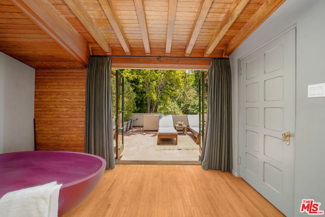 4124 Dundee Drive Los Angeles, CA 90027 - Photo 33 of 54 a bedroom with a bed and wooden floor