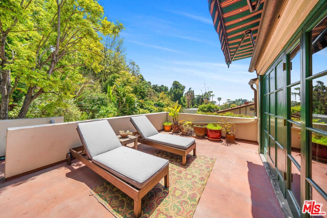 4124 Dundee Drive Los Angeles, CA 90027 - Photo 34 of 54 an outdoor sitting area with furniture and garden