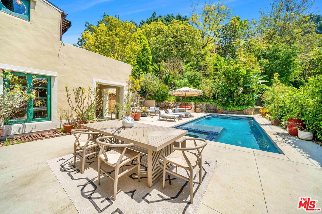 4124 Dundee Drive Los Angeles, CA 90027 - Photo 37 of 54 a view of swimming pool with outdoor seating and plants