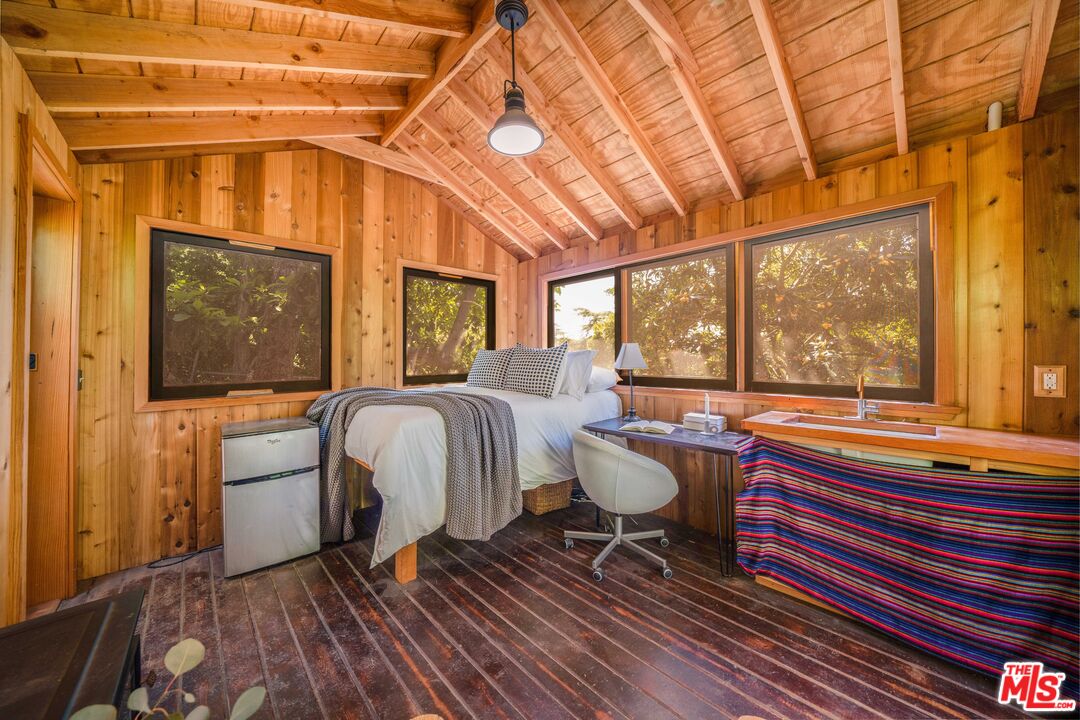 4124 Dundee Drive Los Angeles, CA 90027 - Photo 40 of 54 a living room with furniture and a window
