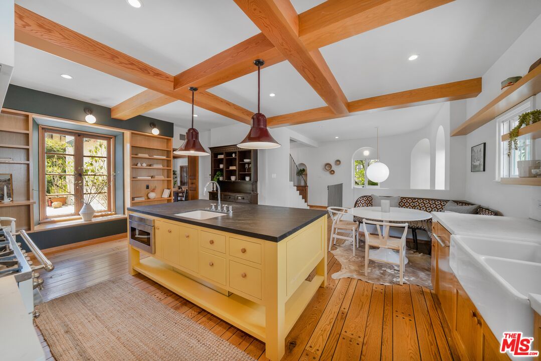 4124 Dundee Drive Los Angeles, CA 90027 - Photo 45 of 54 a kitchen with stainless steel appliances granite countertop a stove and a sink