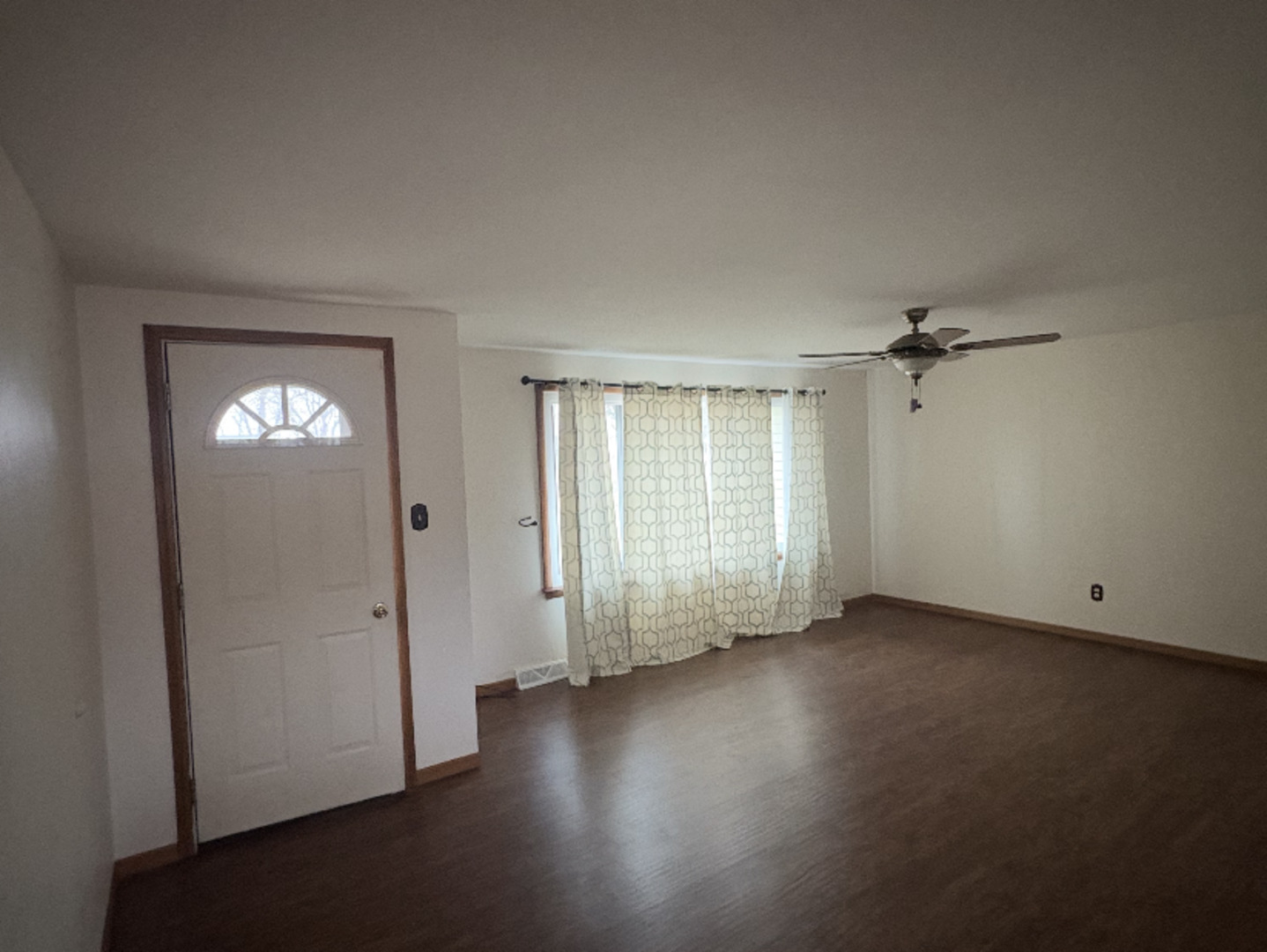 1907 Coalville Road Streator, IL 61364 - Photo 31 of 36 an empty room with wooden floor and windows