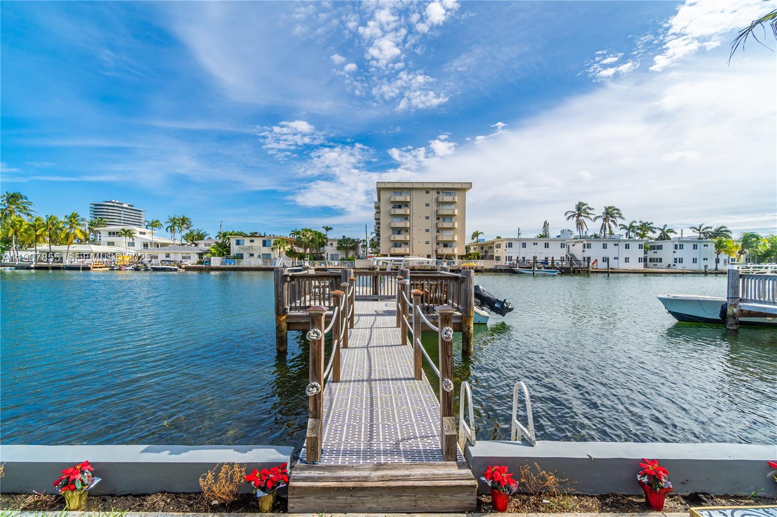 8335 Crespi Boulevard, Unit 4 Miami Beach, FL 33141 - Photo 20 of 25 a view of a lake with a large bridge