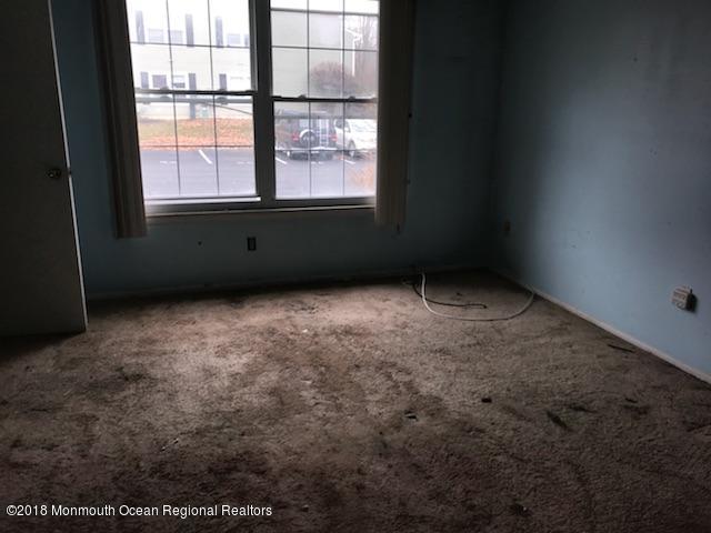 502 Harding Road Freehold, NJ 07728 - Photo 5 of 9 an empty room with a window
