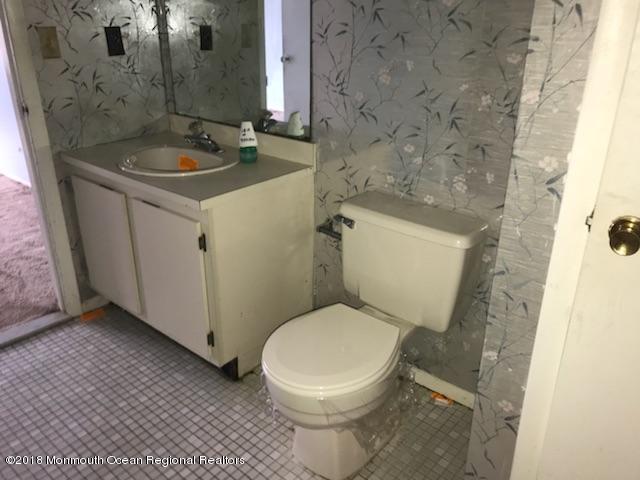 502 Harding Road Freehold, NJ 07728 - Photo 8 of 9 a bathroom with a sink and a toilet
