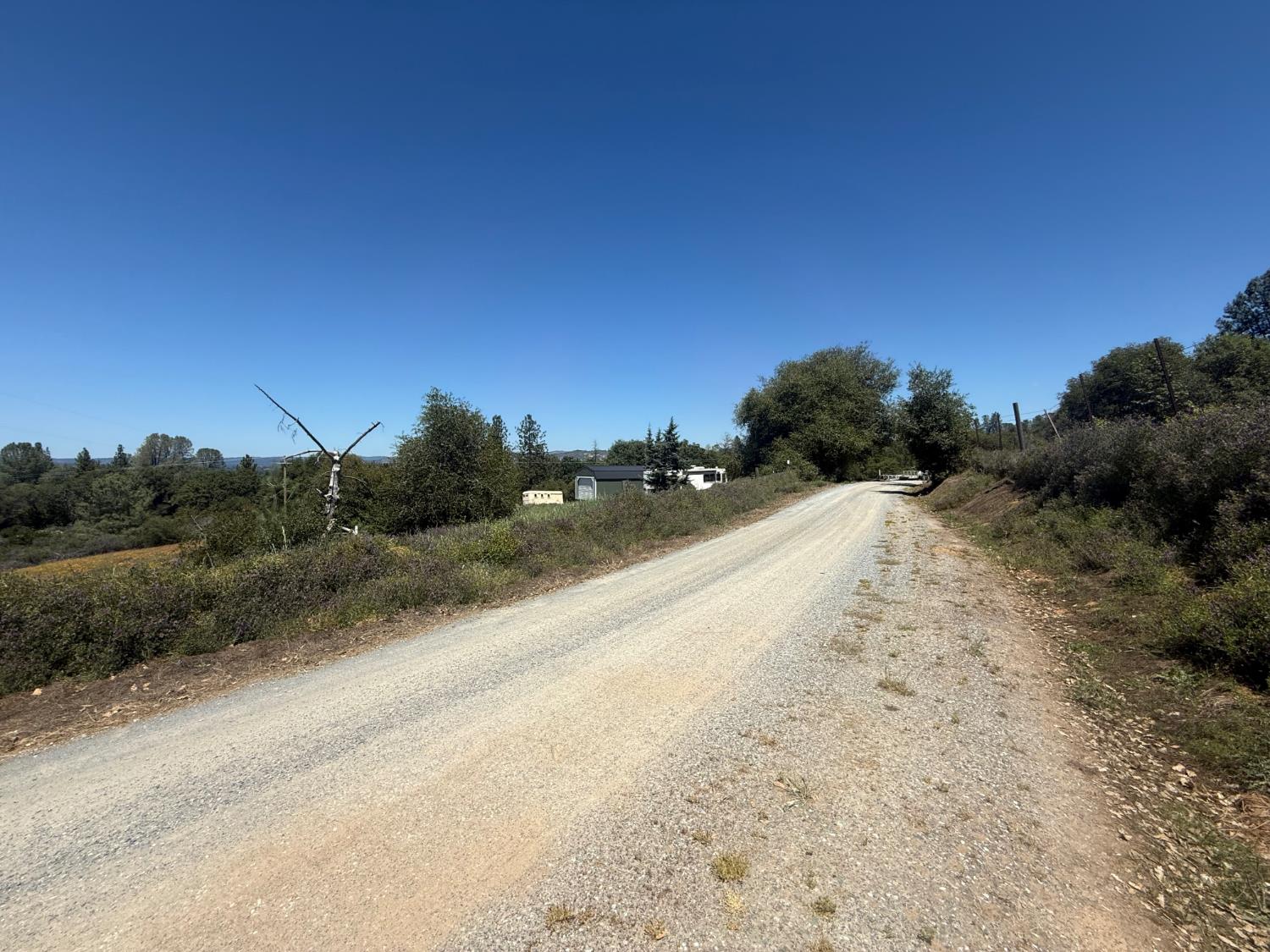 2322 Myrick Road Somerset, CA 95684 - Photo 26 of 30 a view of a road with a yard