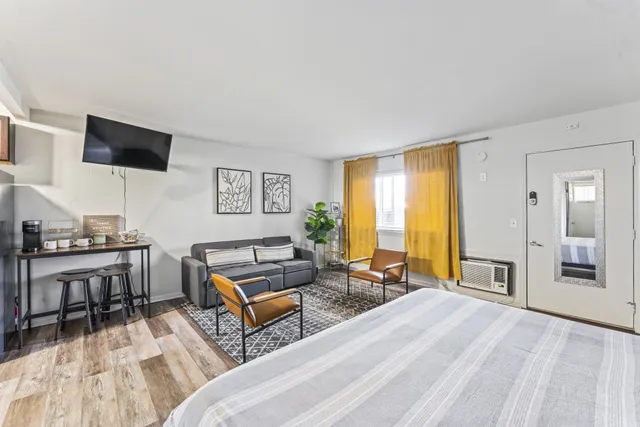 a living room with furniture and a flat screen tv