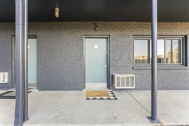a backyard of a house with sofas