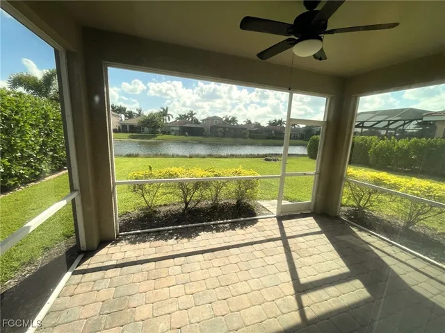 a view of a floor to ceiling window with a floor to ceiling window next to a yard