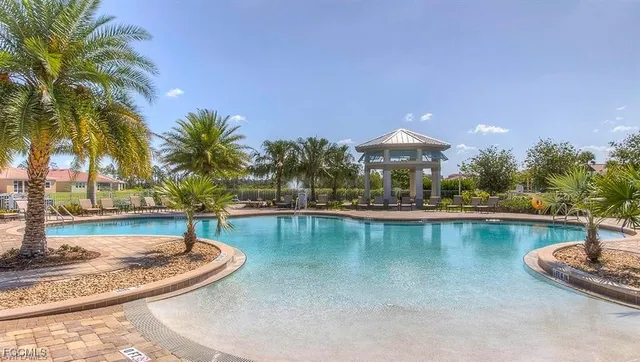a view of a swimming pool and lounge chair