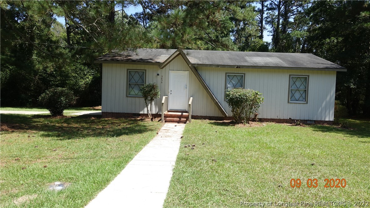 5856 Columbine Road Fayetteville, NC 28306 - Photo 1 of 25 a view of a house with backyard and garden