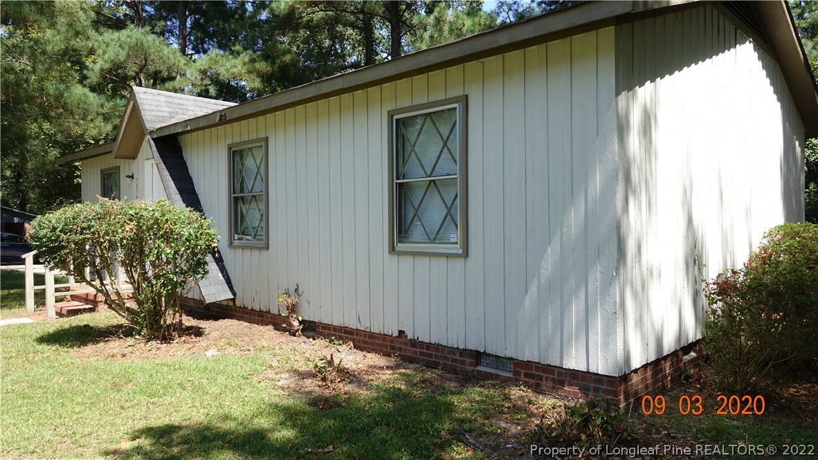 5856 Columbine Road Fayetteville, NC 28306 - Photo 2 of 25 a view of a house with backyard and plants