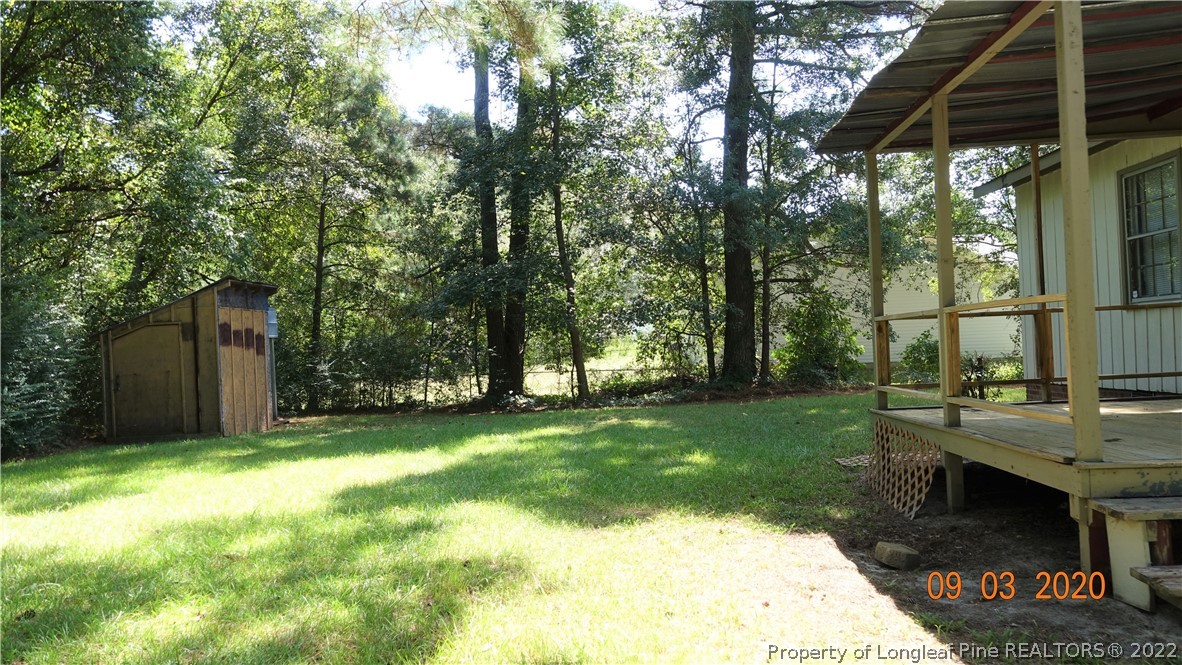 5856 Columbine Road Fayetteville, NC 28306 - Photo 23 of 25 a view of a backyard with tree