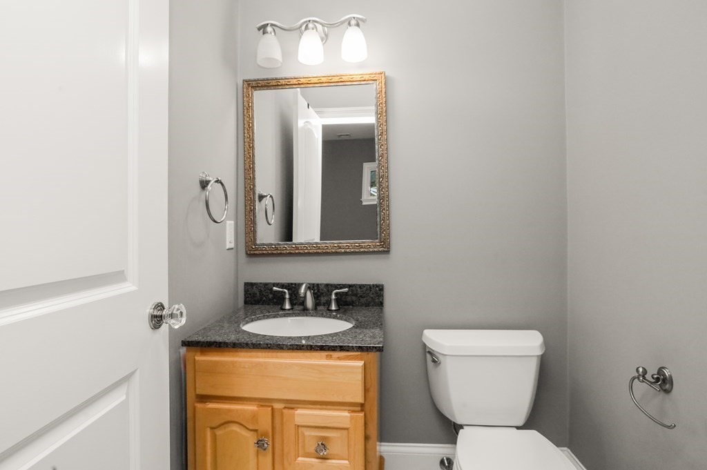 1 Fairbanks Road Lexington, MA 02421 - Photo 23 of 42 a bathroom with a toilet sink and mirror
