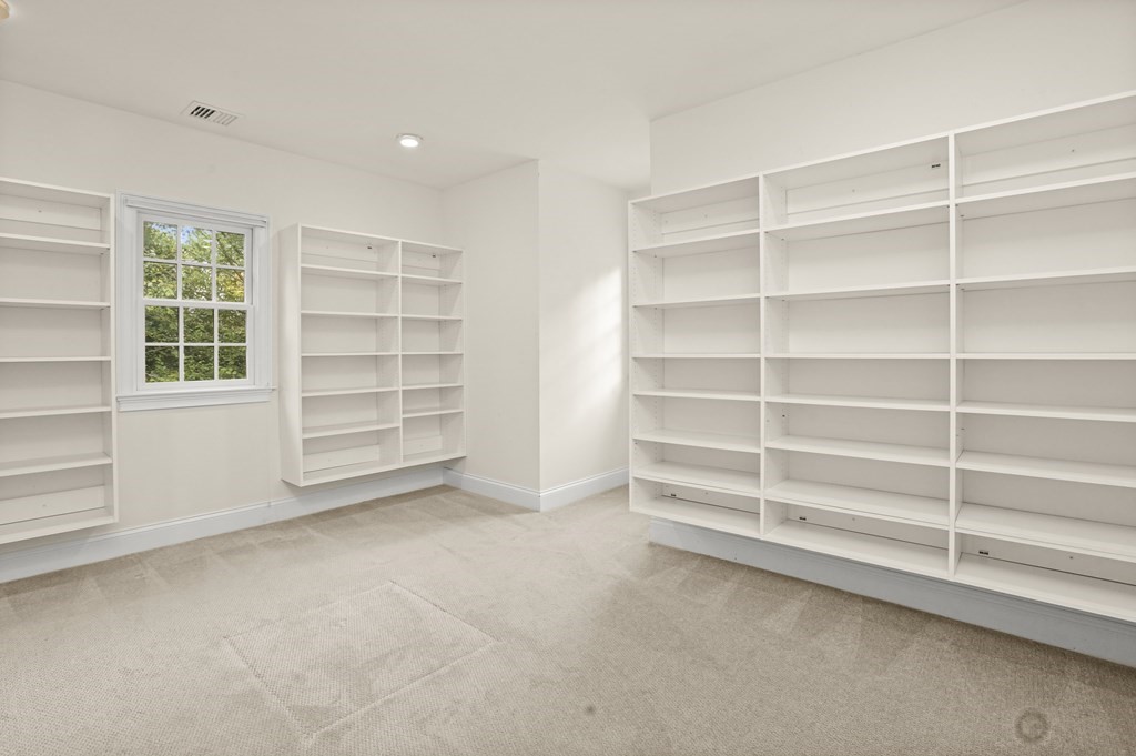 1 Fairbanks Road Lexington, MA 02421 - Photo 34 of 42 a view of an empty room with a empty shelves